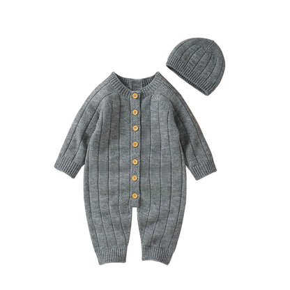 Warme gebreide babyromper en mutsset